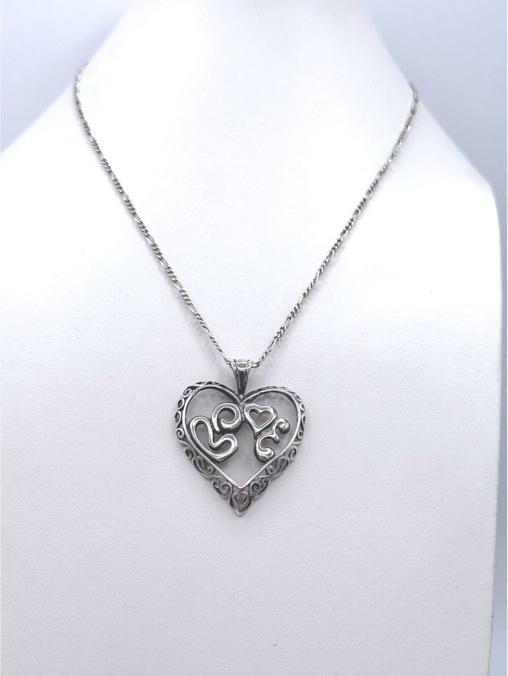 Sterling silver figaro chain with scrolling open heart pendant necklace